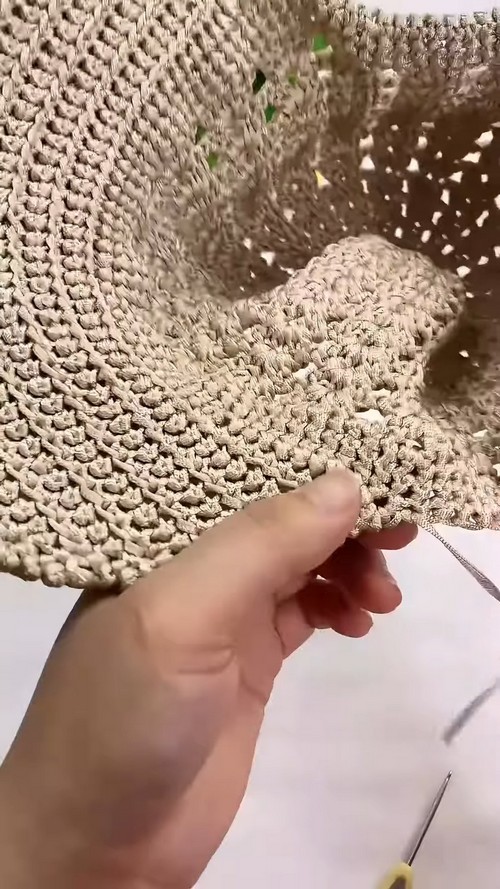 Close-up of the two-panel crochet brim on a summer baseball cap, highlighting the single-crochet rows and curved shape.